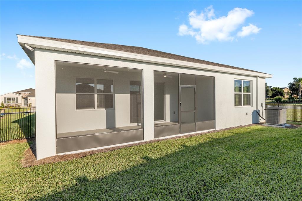 3972 Northwest 48th Terrace Ocala, FL 34482 - Photo 58 of 63 a view of backyard with large windows and plants