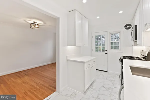a bathroom with a sink a mirror and a bathtub