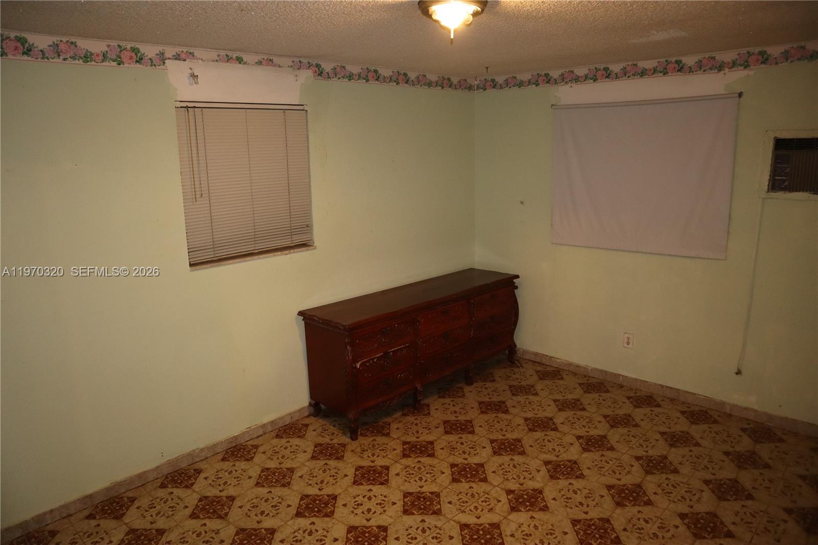 6514 Southwest 107th Place Miami, FL 33173 - Photo 14 of 18 a room with a wooden cabinets