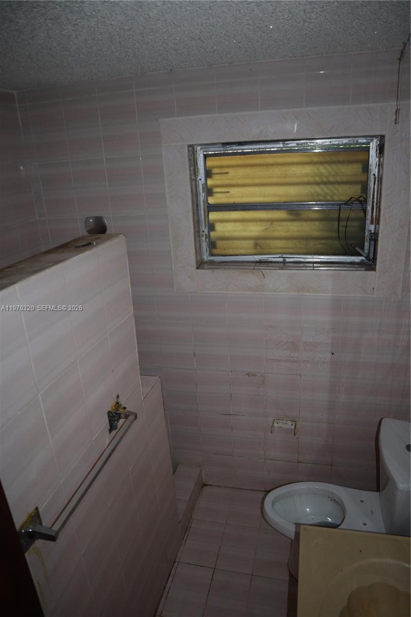 6514 Southwest 107th Place Miami, FL 33173 - Photo 18 of 18 a bathroom with a sink and a toilet