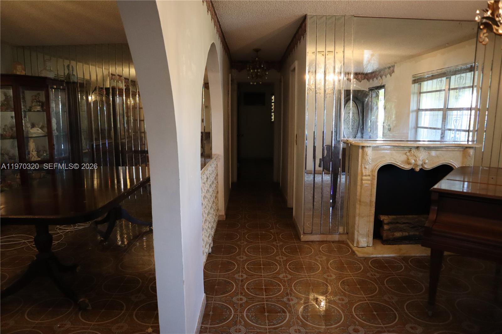 6514 Southwest 107th Place Miami, FL 33173 - Photo 5 of 18 a view of a hallway with seating area