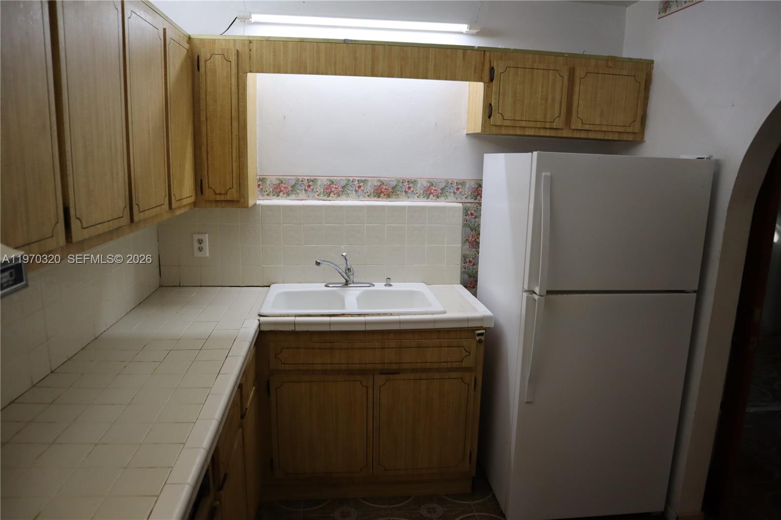 6514 Southwest 107th Place Miami, FL 33173 - Photo 7 of 18 a utility room with dryer and washer