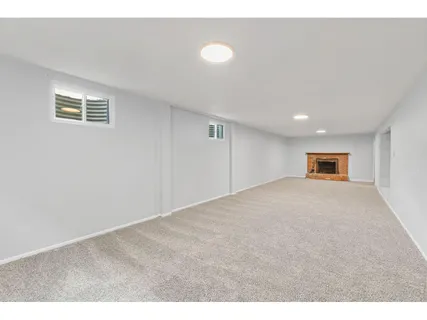 a view of a room with a ceiling fan