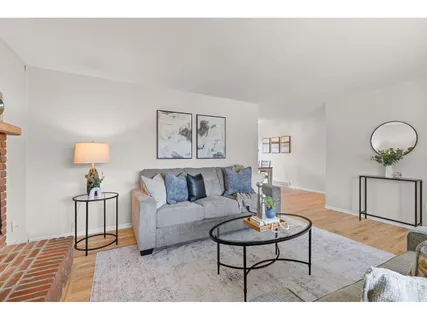 a living room with furniture and a table