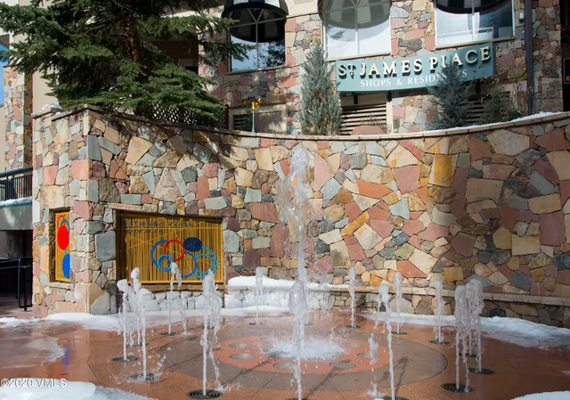 a living room with fireplace furniture and a flat screen tv