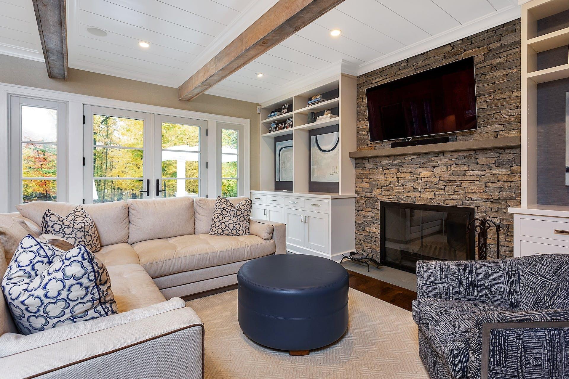 75 Parish Road New Canaan, CT 06840 - Photo 11 of 38 a living room with furniture a flat screen tv and a fireplace