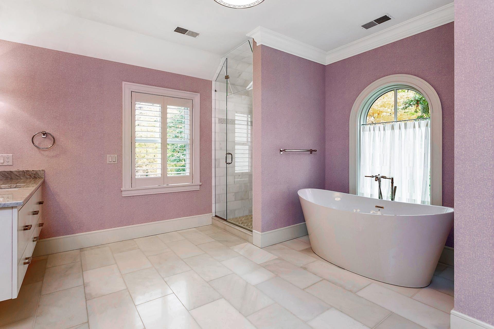 75 Parish Road New Canaan, CT 06840 - Photo 18 of 38 a living room with a bathtub and a window