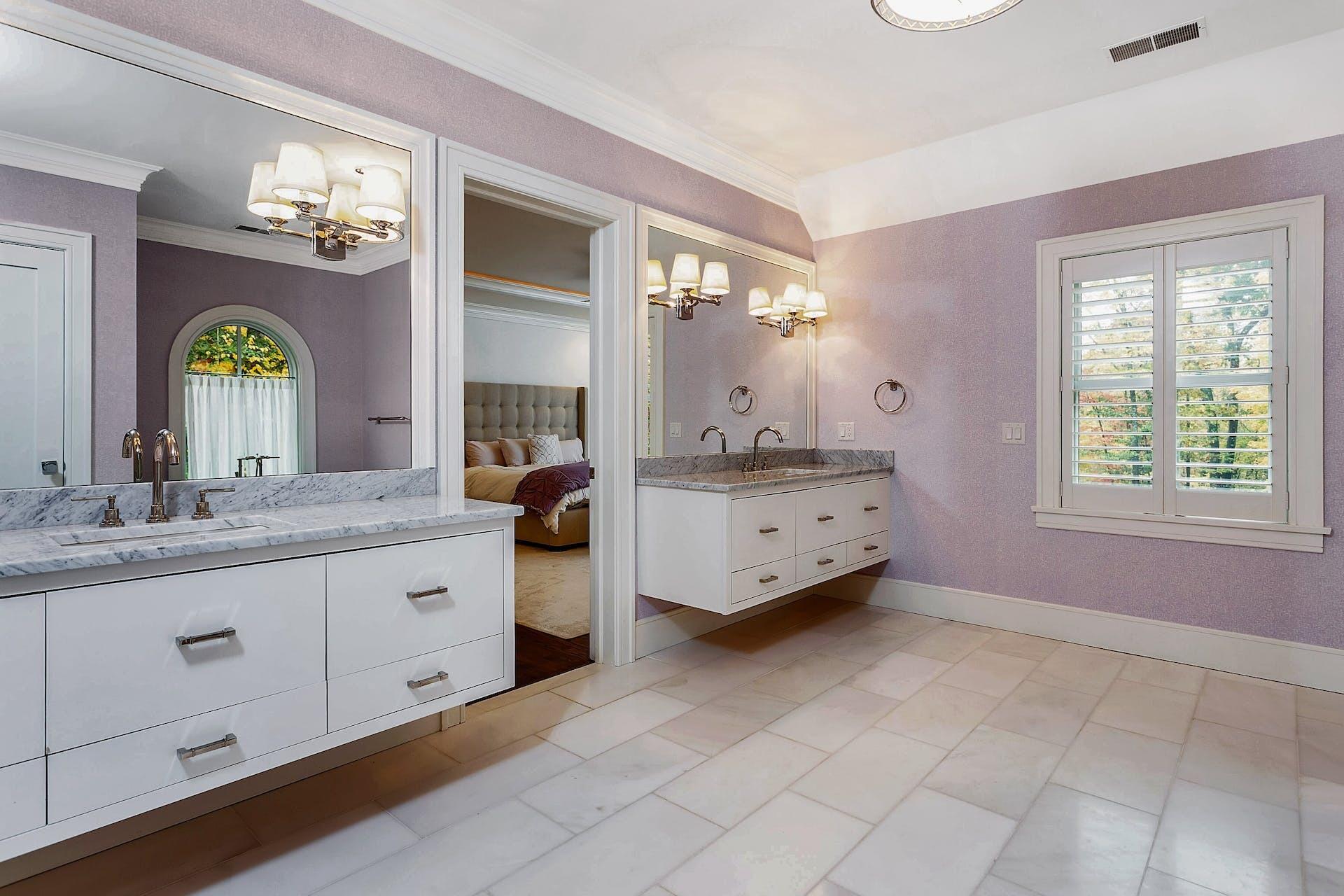75 Parish Road New Canaan, CT 06840 - Photo 19 of 38 a spacious bathroom with double sink and a mirror