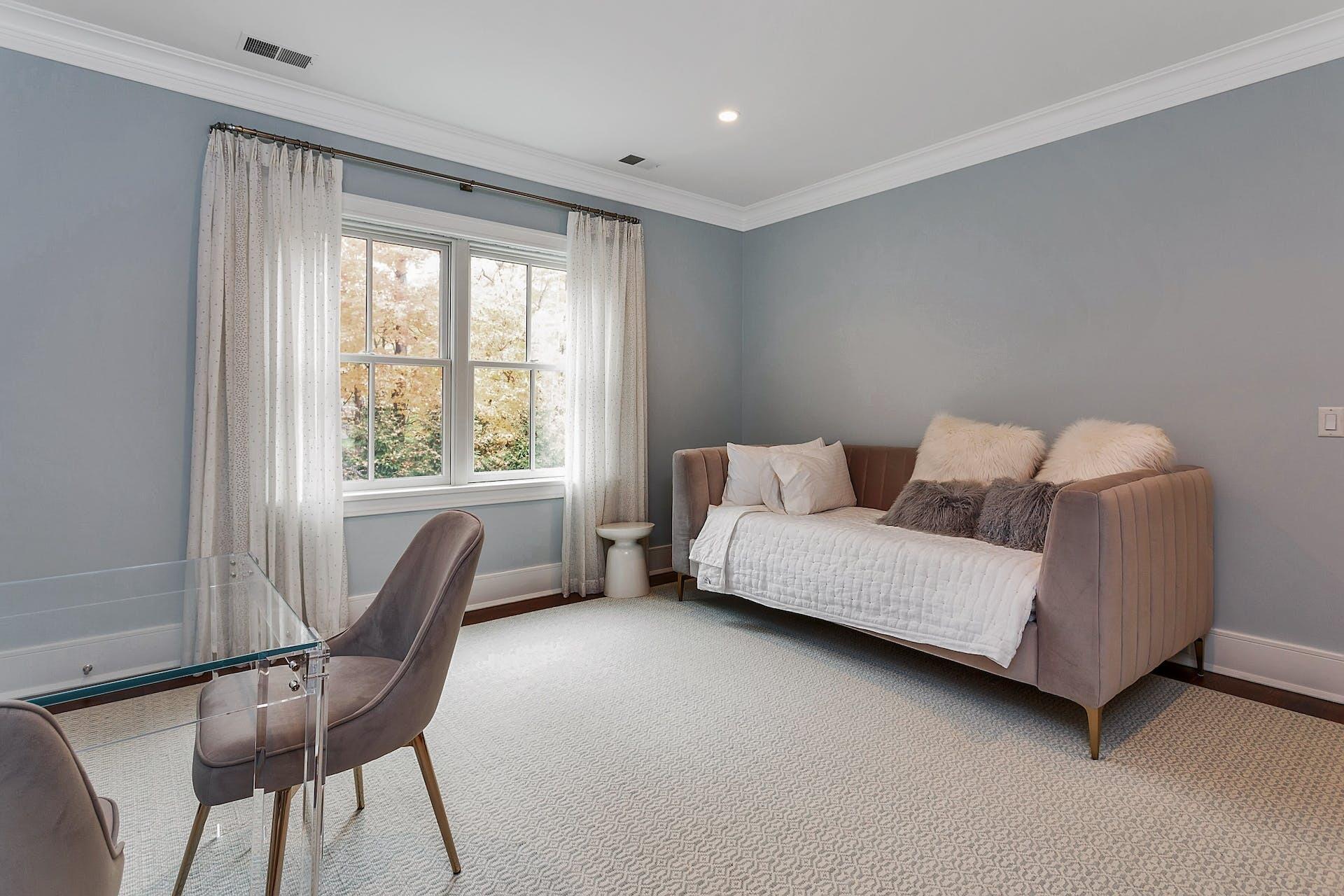 75 Parish Road New Canaan, CT 06840 - Photo 22 of 38 a bedroom with a bed and a window