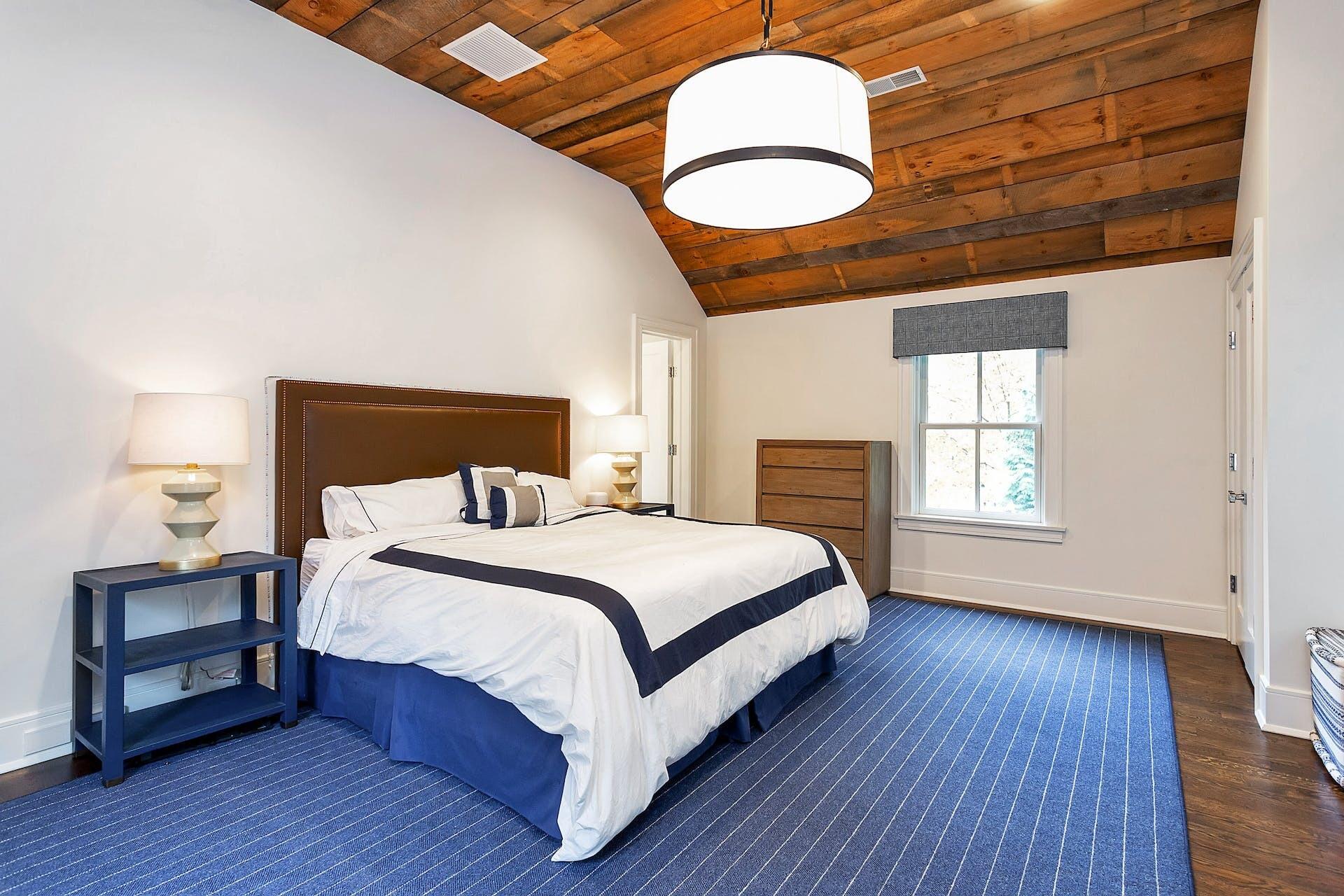 75 Parish Road New Canaan, CT 06840 - Photo 23 of 38 a bedroom with a bed and wooden floor