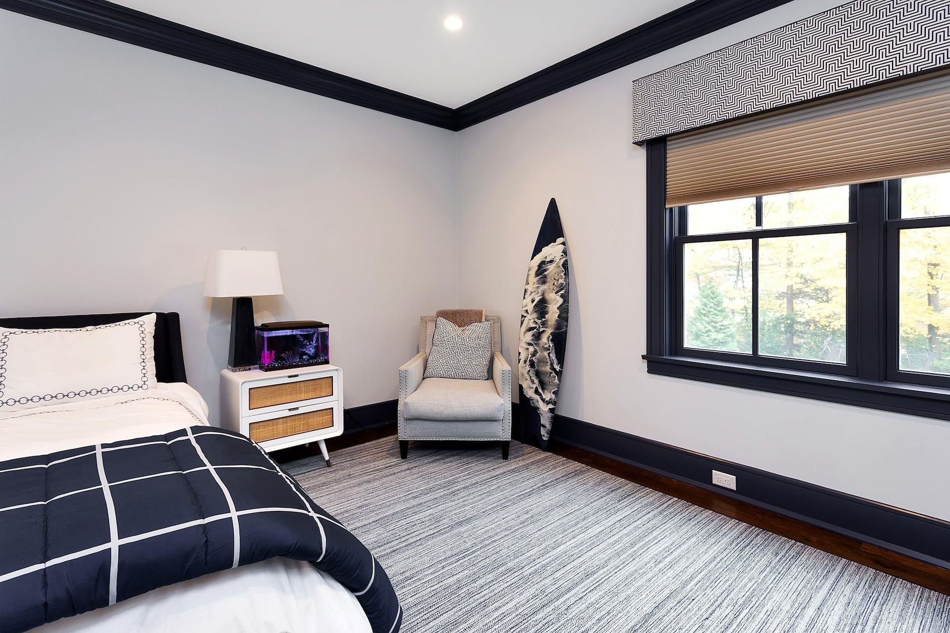 75 Parish Road New Canaan, CT 06840 - Photo 24 of 38 a bedroom with furniture and a large window