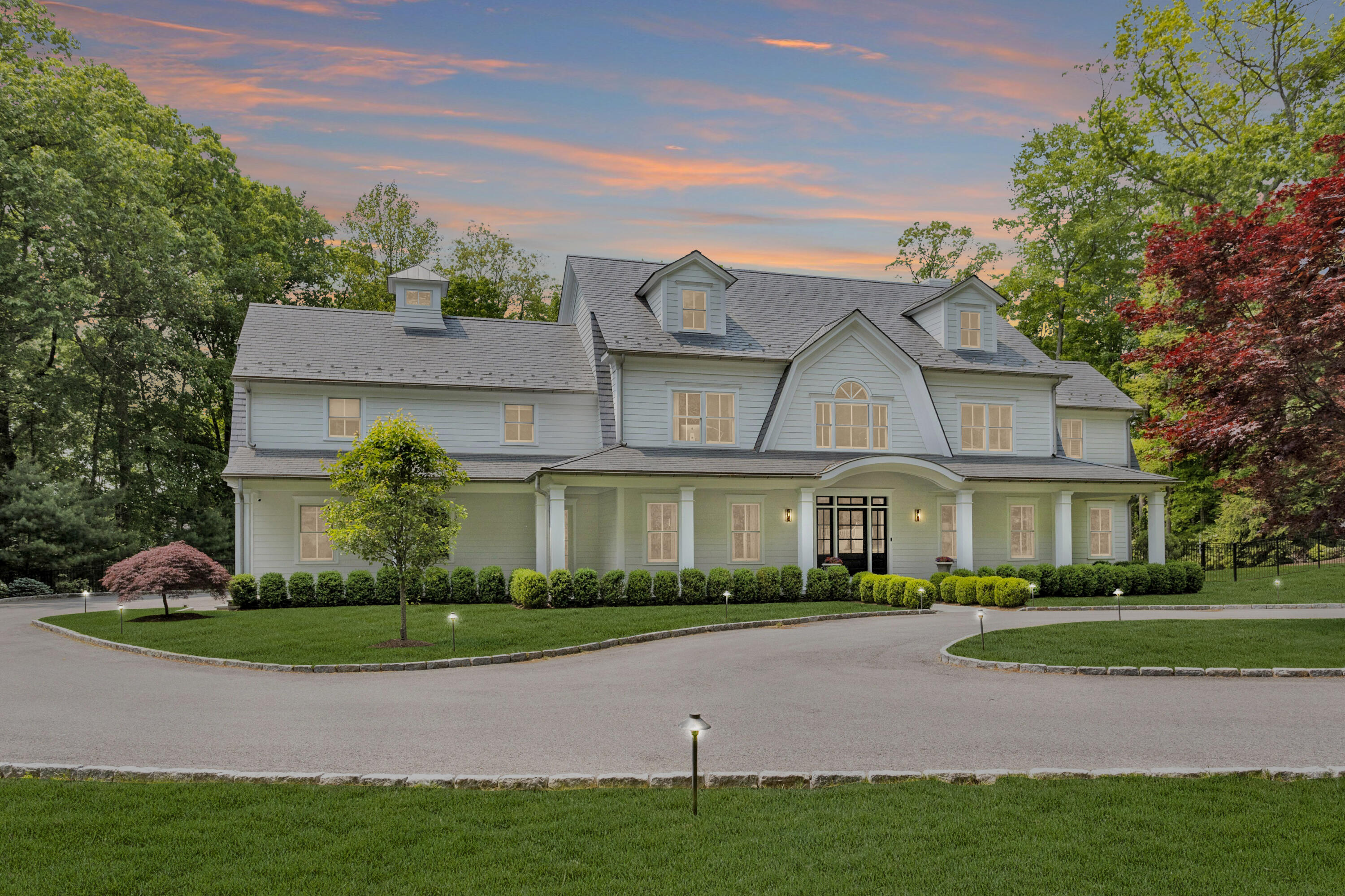 75 Parish Road New Canaan, CT 06840 - Photo 34 of 38 a front view of a house with a garden