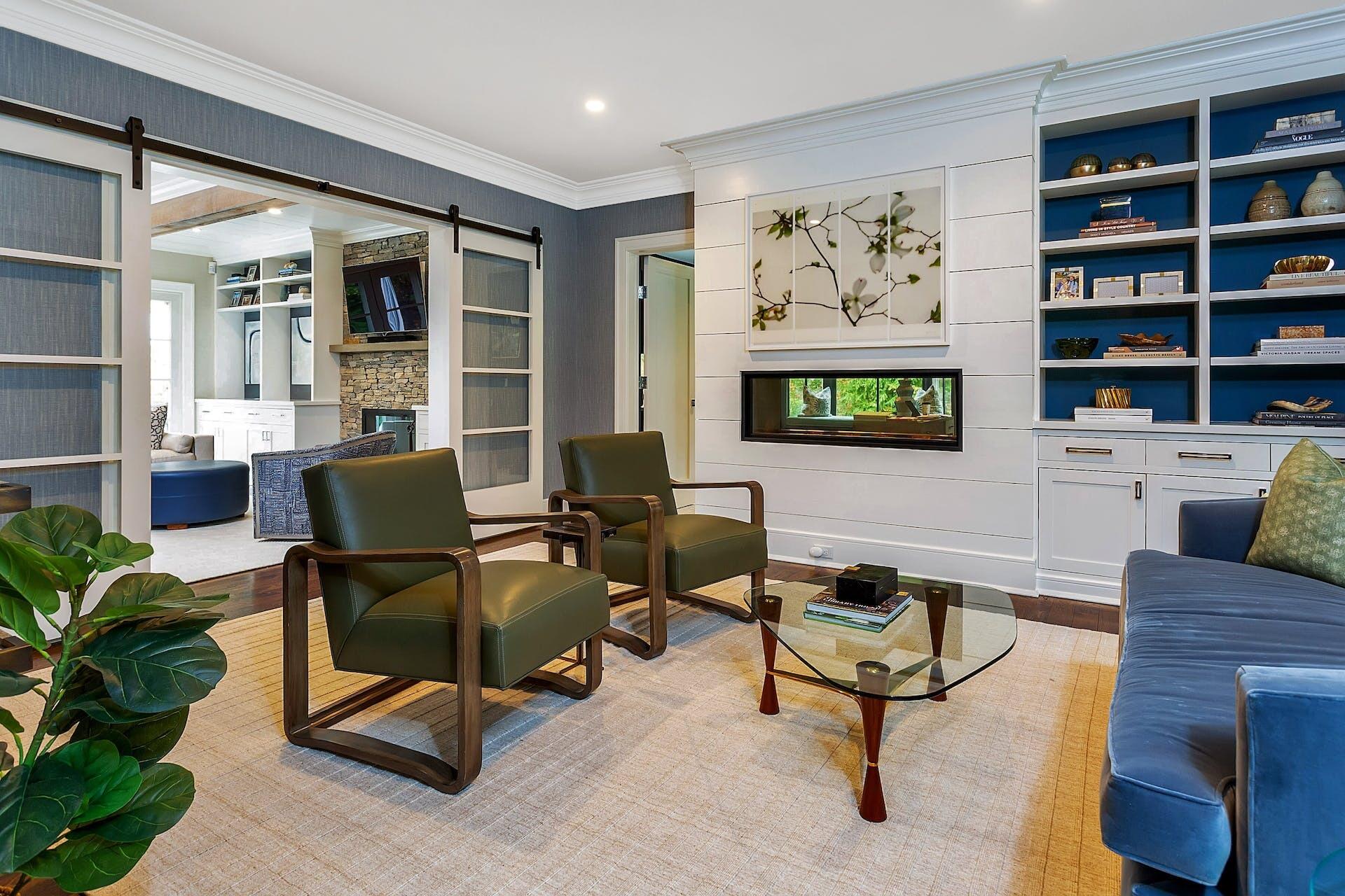 75 Parish Road New Canaan, CT 06840 - Photo 9 of 38 a living room with furniture a bookshelf and a window
