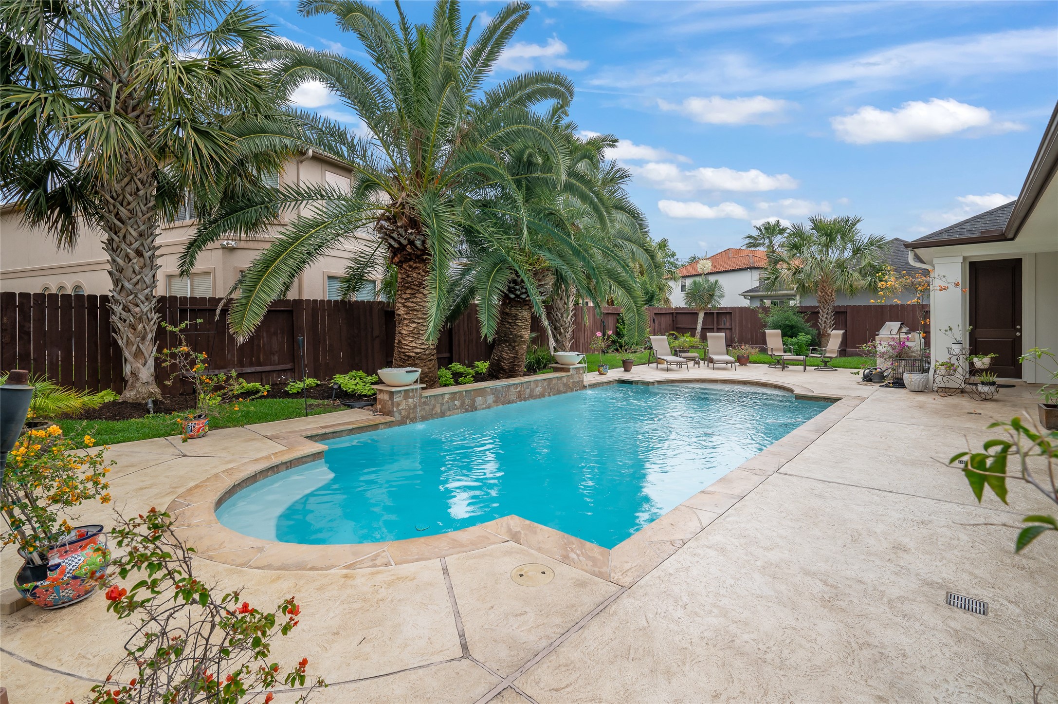2127 Thicket Ridge Lane Houston, TX 77077 - Photo 38 of 48 The backyard pool area features an enlarged pool deck for entertaining and multiple furniture configurations. The home's north/south placement is an extremely desired placement.