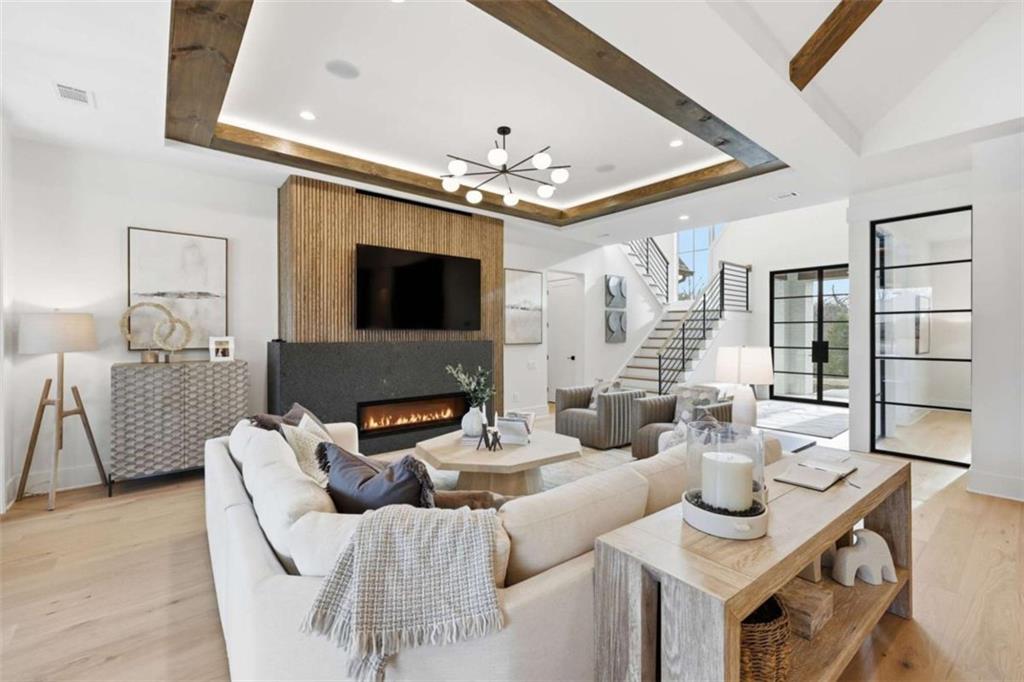 4632 A Shirley Road Gainesville, GA 30506 - Photo 13 of 72 a living room with furniture a fireplace and a flat screen tv
