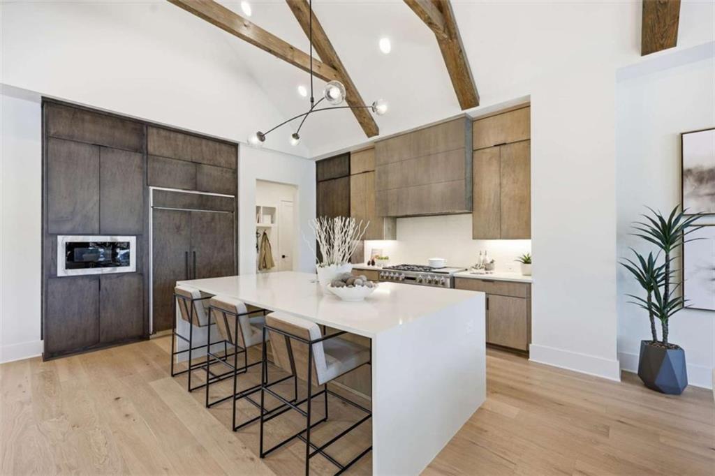 4632 A Shirley Road Gainesville, GA 30506 - Photo 14 of 72 a kitchen with stainless steel appliances a stove a sink dishwasher a refrigerator and cabinets with wooden floor
