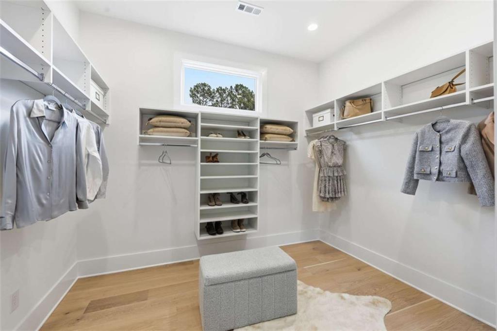 4632 A Shirley Road Gainesville, GA 30506 - Photo 24 of 72 a view of walk in closet with clothes and shoes