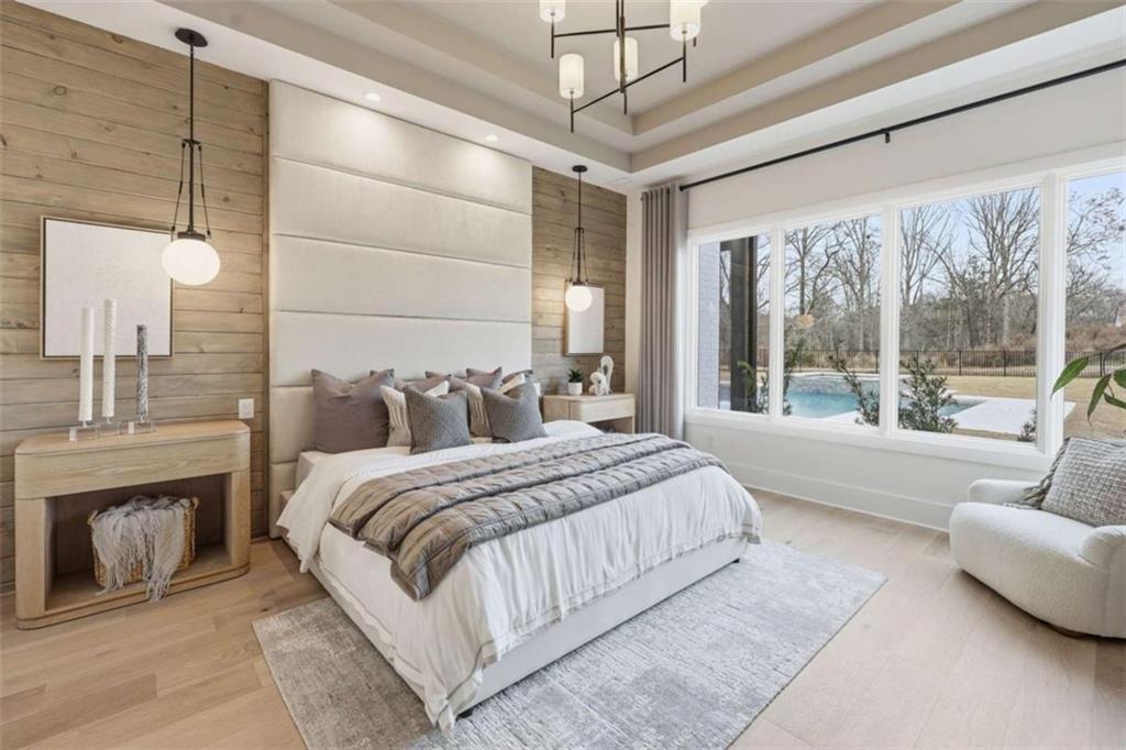 4632 A Shirley Road Gainesville, GA 30506 - Photo 27 of 72 a spacious bedroom with a large bed and a couch