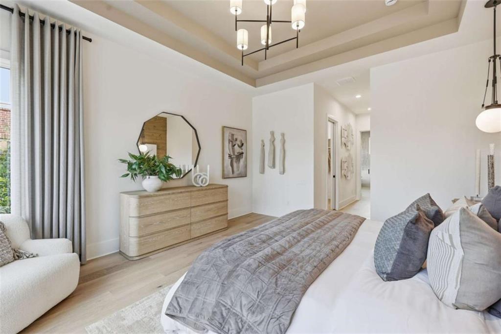 4632 A Shirley Road Gainesville, GA 30506 - Photo 28 of 72 a bedroom with a bed and a chandelier