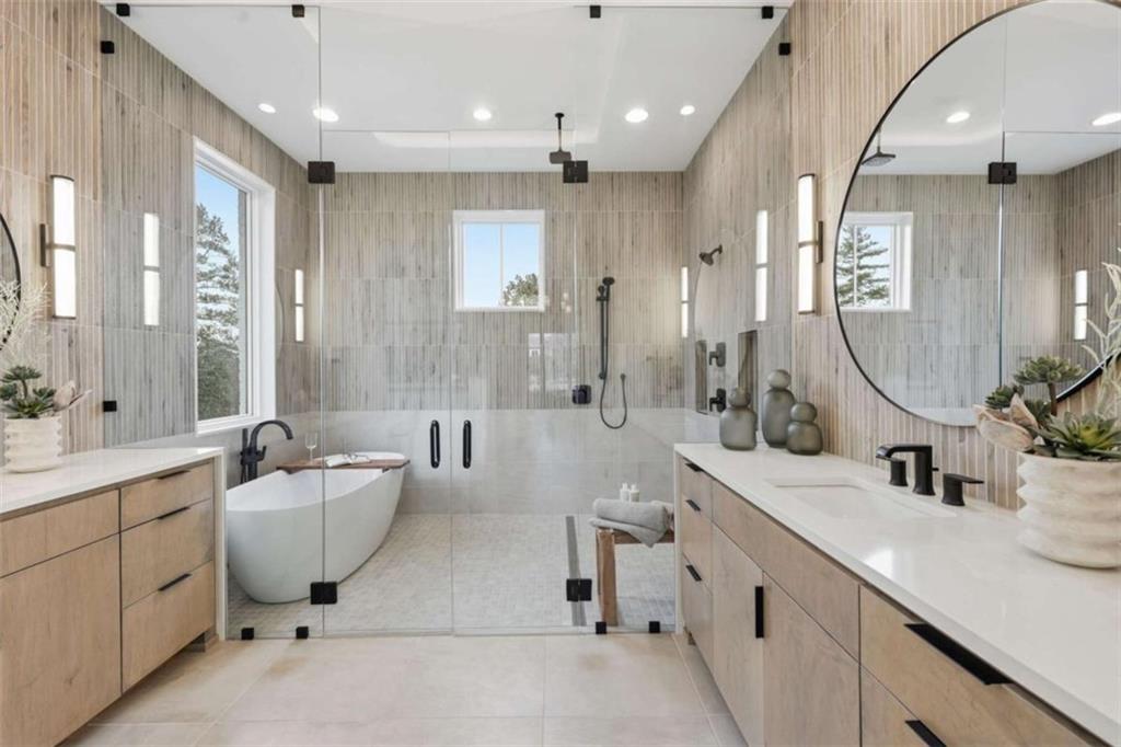 4632 A Shirley Road Gainesville, GA 30506 - Photo 29 of 72 a large bathroom with a double vanity sink a large mirror and a shower
