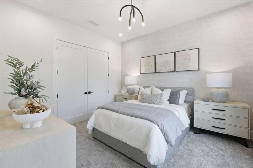 4632 A Shirley Road Gainesville, GA 30506 - Photo 34 of 72 a bedroom with a bed and a potted plant