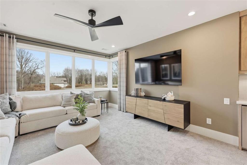 4632 A Shirley Road Gainesville, GA 30506 - Photo 42 of 72 a living room with furniture and a flat screen tv