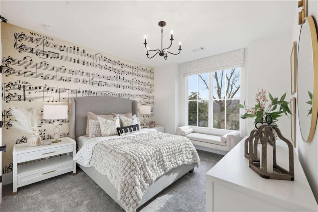 4632 A Shirley Road Gainesville, GA 30506 - Photo 44 of 72 a bedroom with a bed chandelier and a window