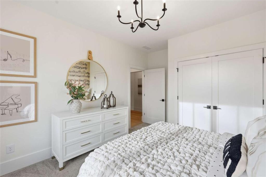 4632 A Shirley Road Gainesville, GA 30506 - Photo 45 of 72 a bedroom with a bed and a dresser in it