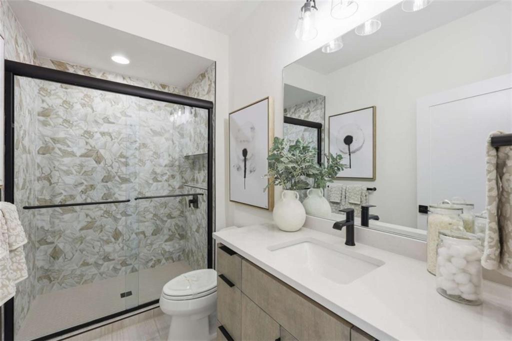 4632 A Shirley Road Gainesville, GA 30506 - Photo 46 of 72 a bathroom with a sink toilet and a mirror