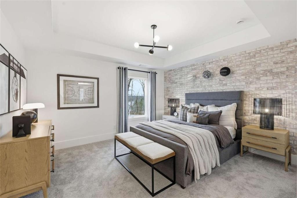 4632 A Shirley Road Gainesville, GA 30506 - Photo 47 of 72 a bedroom with a bed a couch and a window