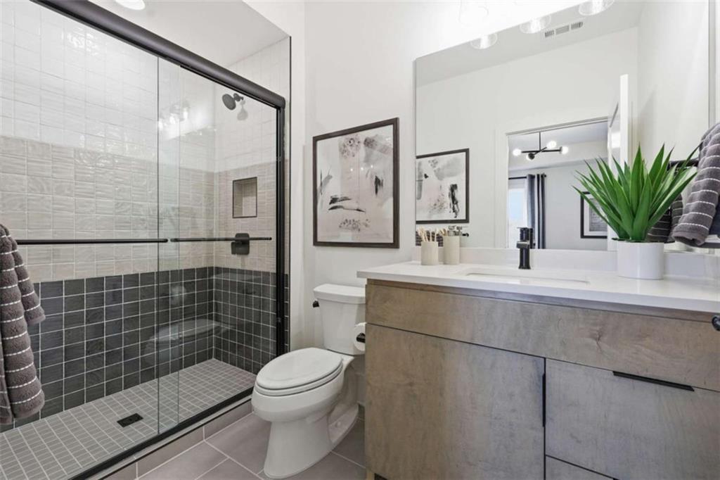 4632 A Shirley Road Gainesville, GA 30506 - Photo 49 of 72 a bathroom with a sink mirror toilet and shower