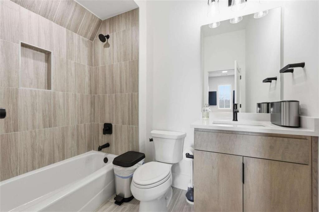 4632 A Shirley Road Gainesville, GA 30506 - Photo 52 of 72 a bathroom with a sink a toilet and shower