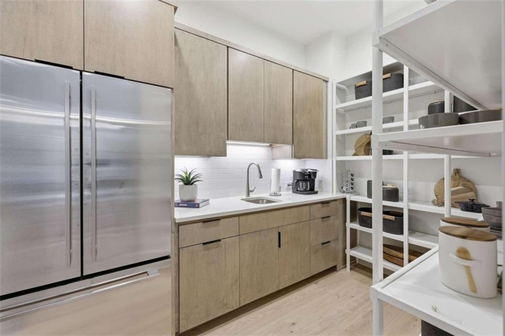 4632 A Shirley Road Gainesville, GA 30506 - Photo 53 of 72 a kitchen with a refrigerator and a sink