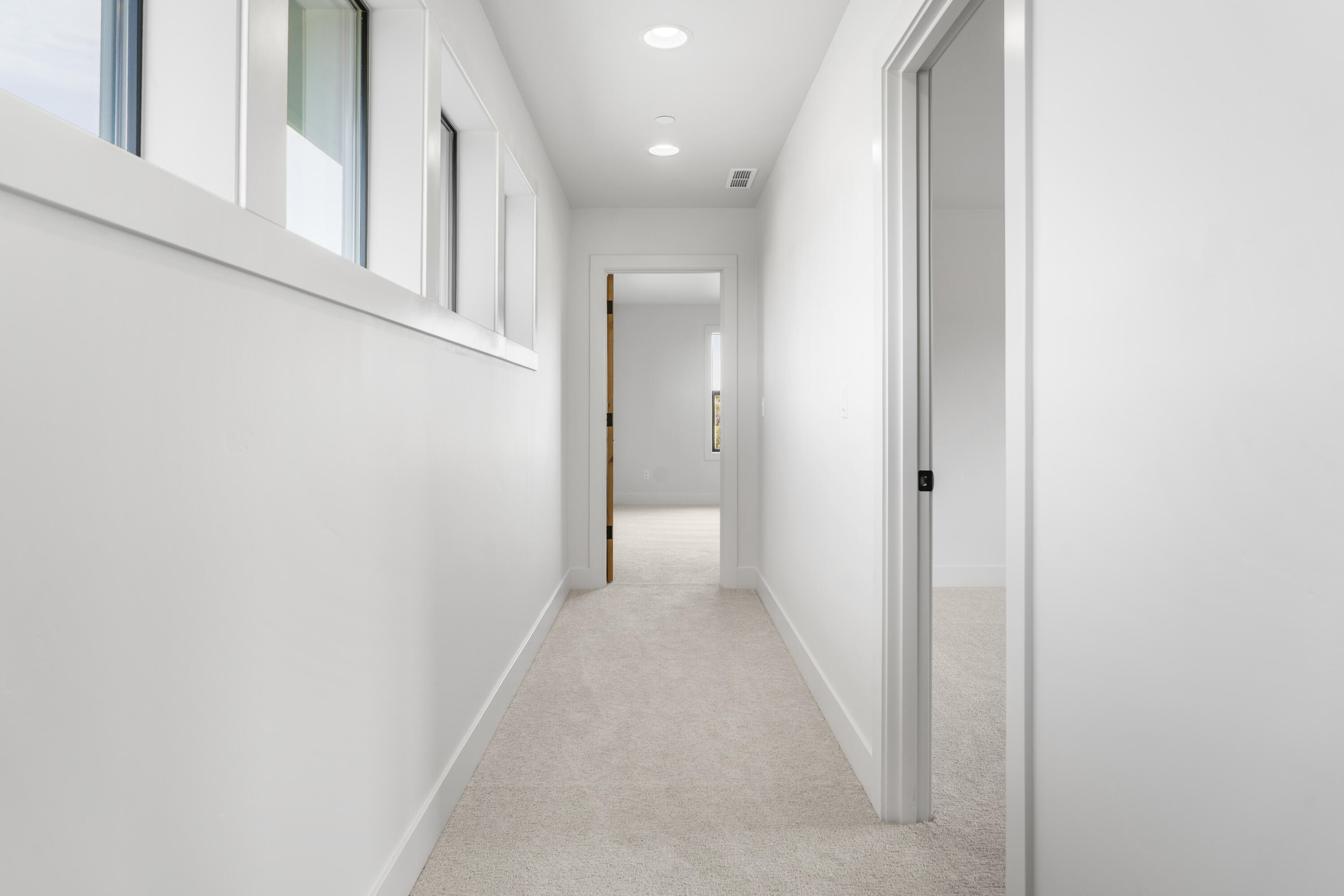 16883 Southwest Paragon Court Powell Butte, OR 97753 - Photo 26 of 42 More well-lit hallways