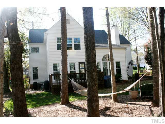 8508 Wheeling Drive Raleigh, NC 27615 - Photo 2 of 12 Private backyard with mature trees and lush landscaping. A great place to unwind with friends and family.