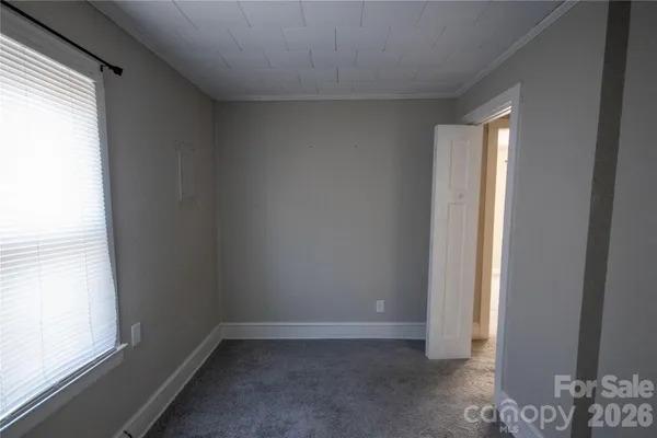 a view of an empty room and window