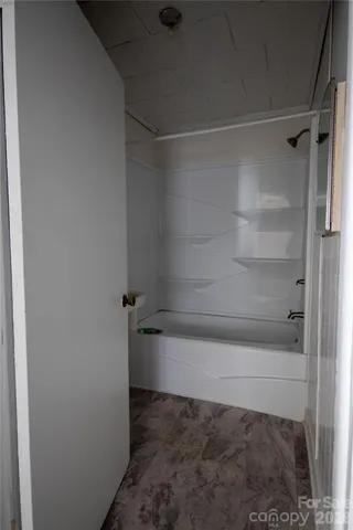 a bathroom with a bath tub