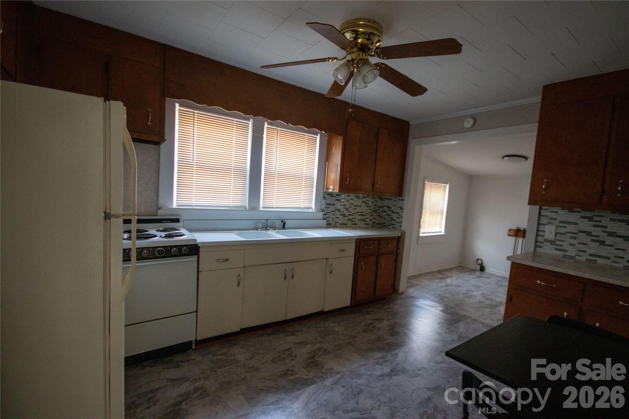 231 Cedar Valley Road Hudson, NC 28638 - Photo 18 of 33 a kitchen with a sink stove and refrigerator