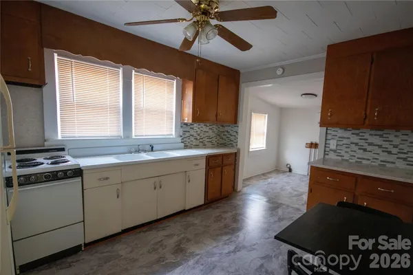 a kitchen with a stove and a sink