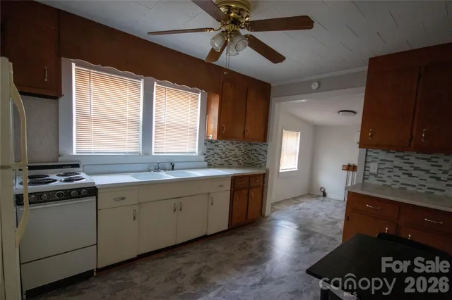 a kitchen with a stove and a sink