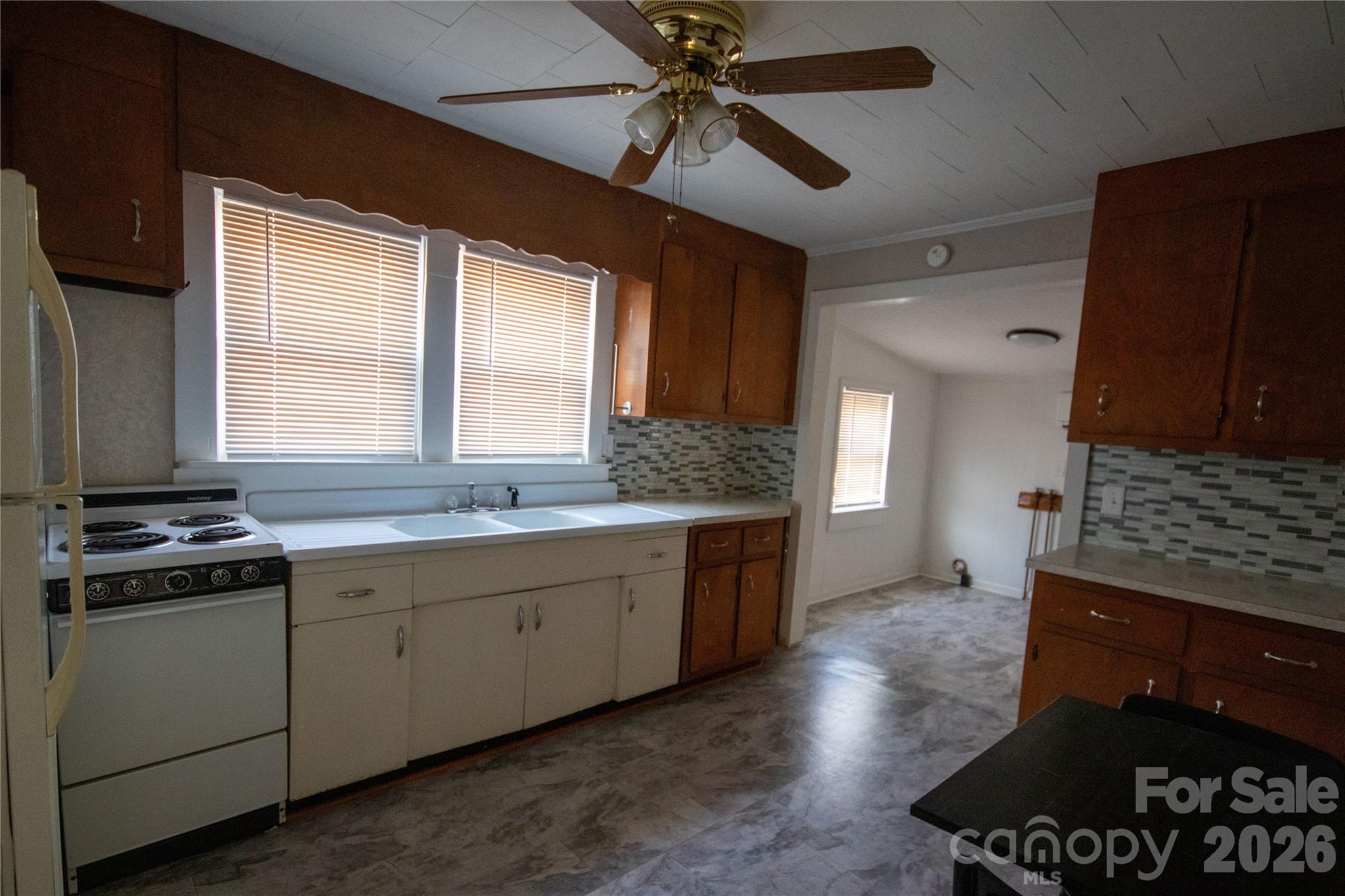 231 Cedar Valley Road Hudson, NC 28638 - Photo 20 of 33 a kitchen with a stove and a sink