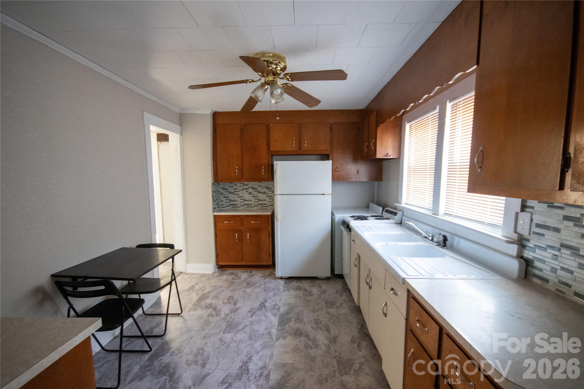 231 Cedar Valley Road Hudson, NC 28638 - Photo 22 of 33 a kitchen with a sink appliances and a window