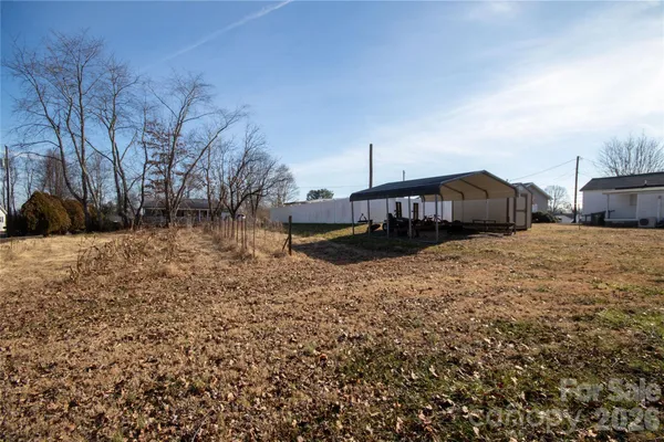 a view of a yard with trees