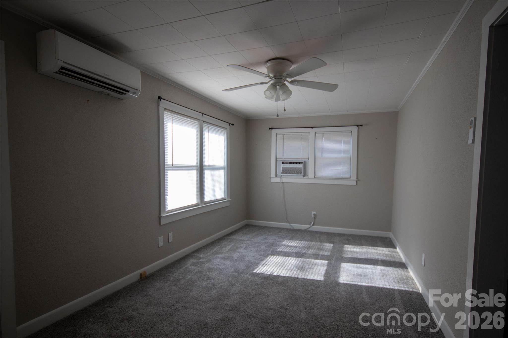 231 Cedar Valley Road Hudson, NC 28638 - Photo 7 of 33 a view of room with window and ceiling fan