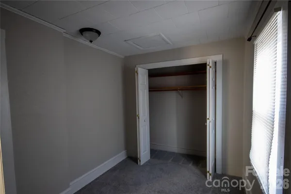 a view of an empty room and window