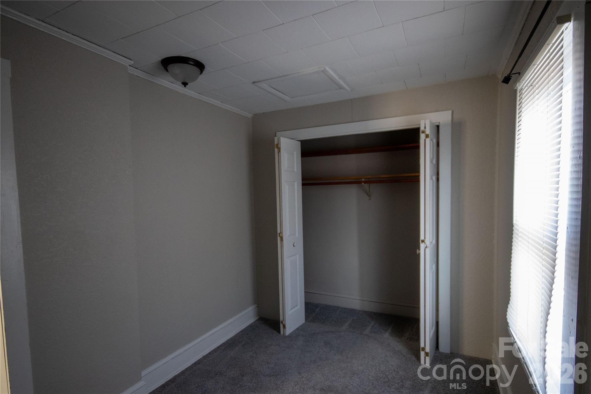 231 Cedar Valley Road Hudson, NC 28638 - Photo 10 of 33 a view of an empty room and window