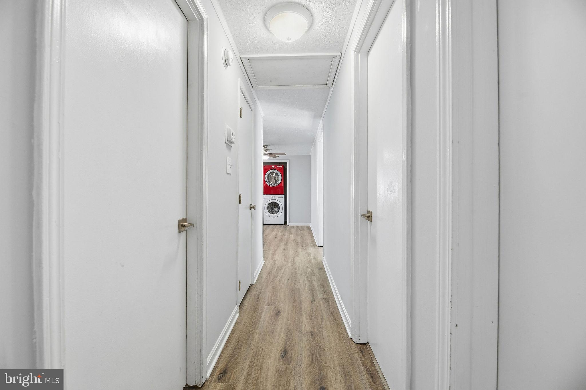 13108 Joy Road Lusby, MD 20657 - Photo 15 of 40 a view of a hallway with wooden floor and entryway