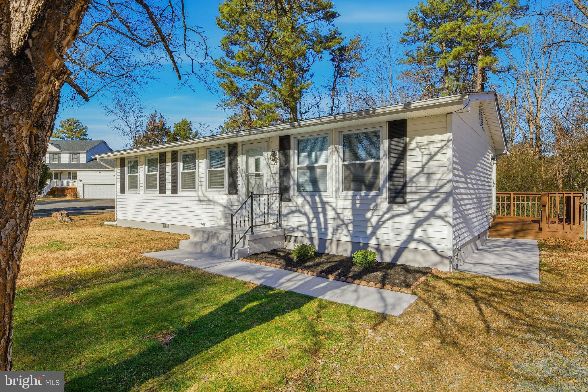13108 Joy Road Lusby, MD 20657 - Photo 20 of 40 a view of a house with backyard and sitting area