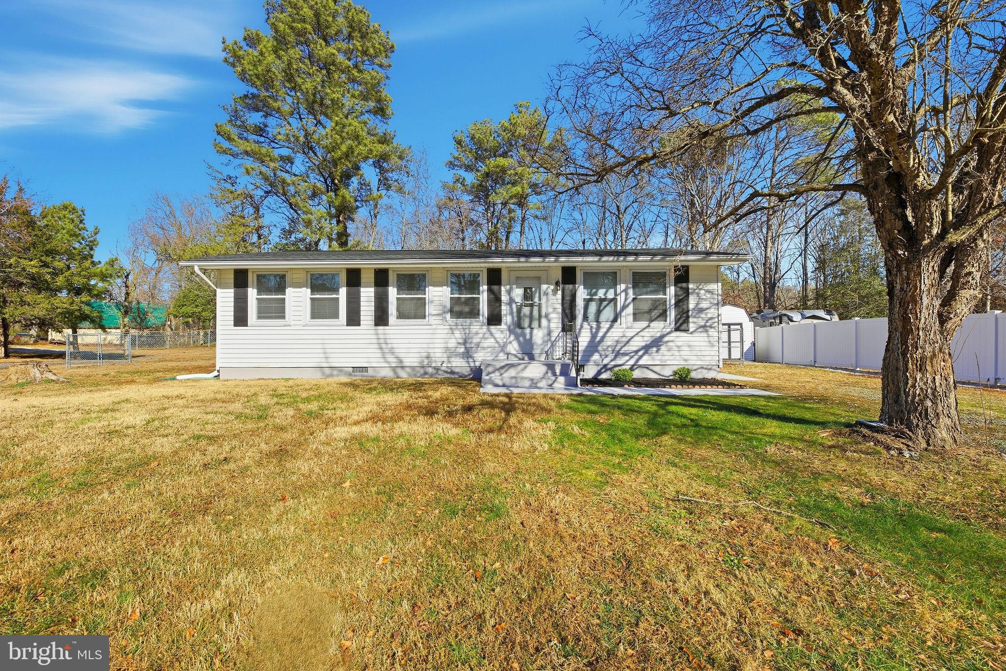 13108 Joy Road Lusby, MD 20657 - Photo 2 of 40 a view of a house with garden and a tree