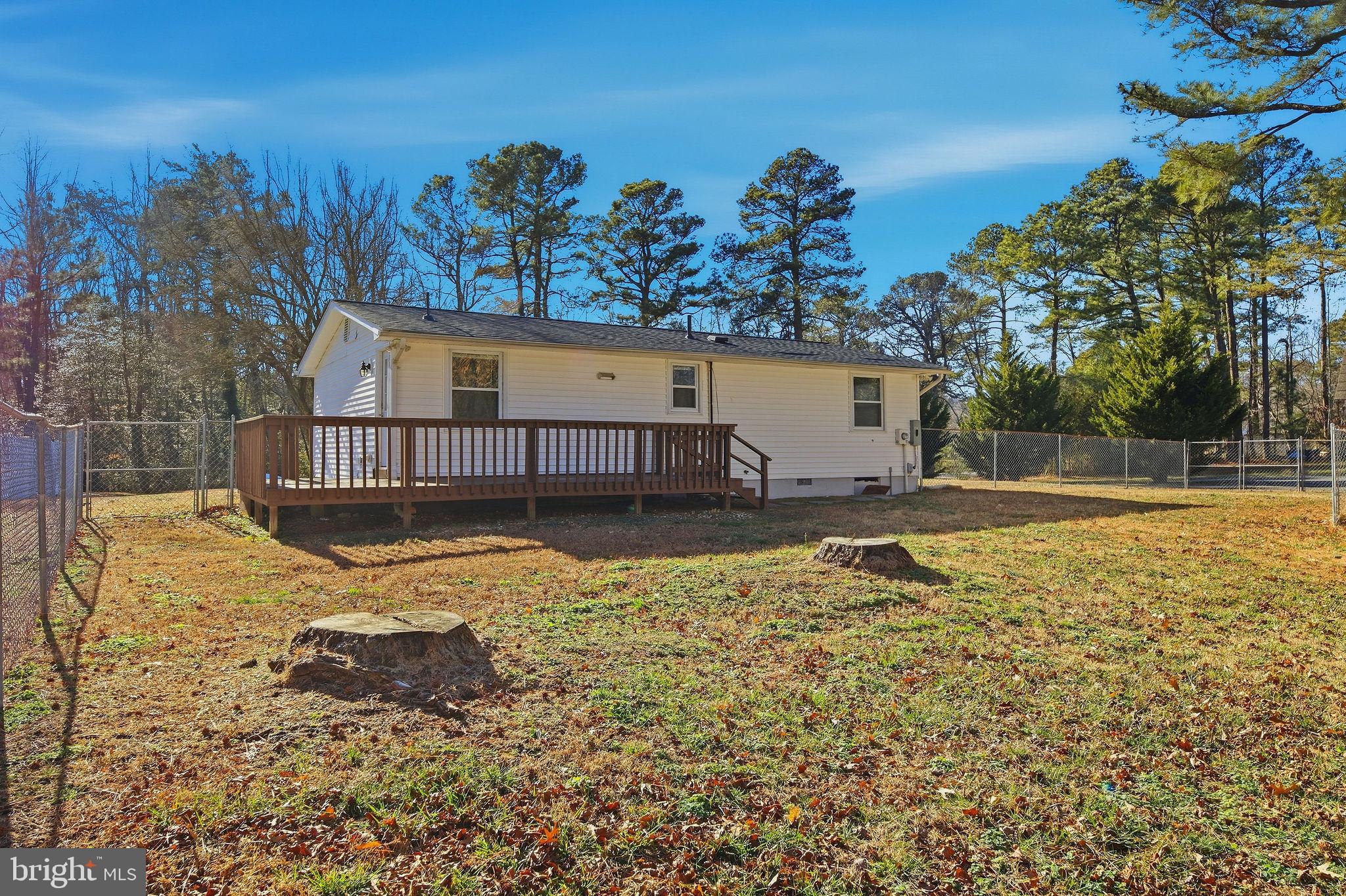 13108 Joy Road Lusby, MD 20657 - Photo 23 of 40 a view of a house with a yard covered with snow in the background